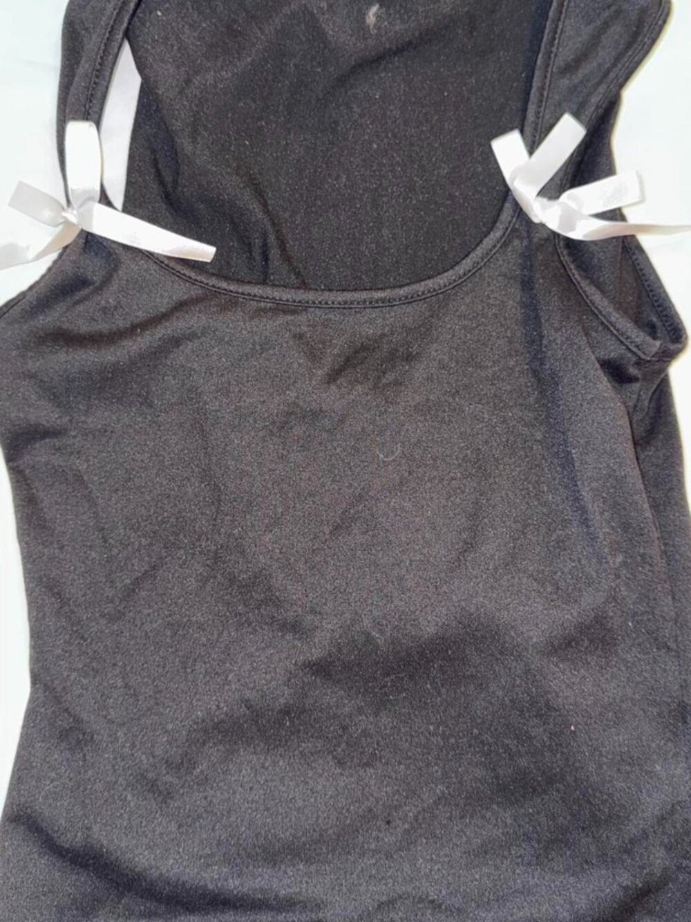 Black tank top with white bow detail